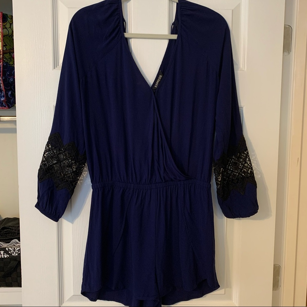 Navy blue v-neck romper with black details